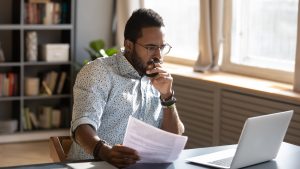 Man thinking of objections to group captive insurance image