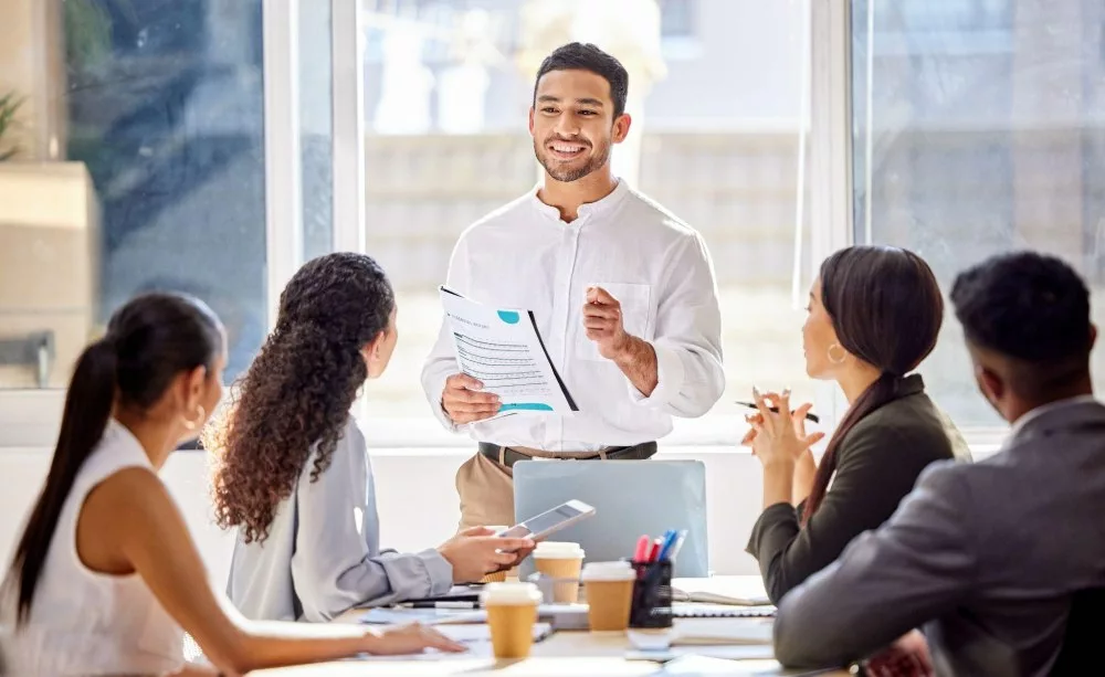 man-presenting-information-on-self-funded-captive vs level funded insurance_Roundstone Insurance