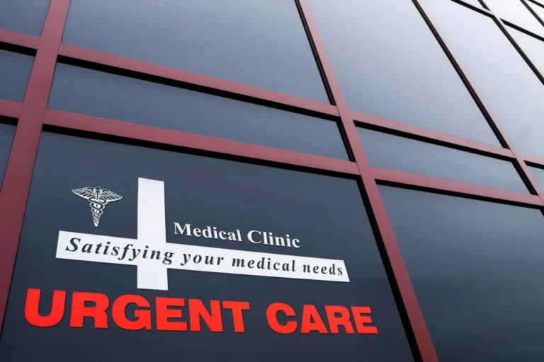 The exterior window signage of an urgent care medical clinic.