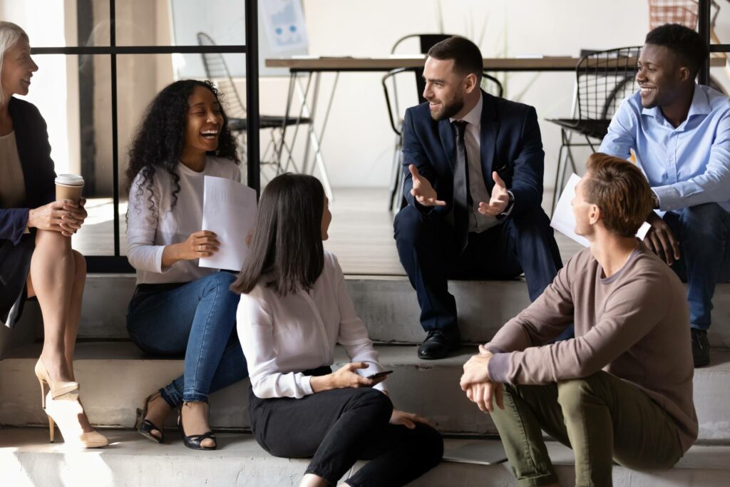 group of colleagues discussing self-funding