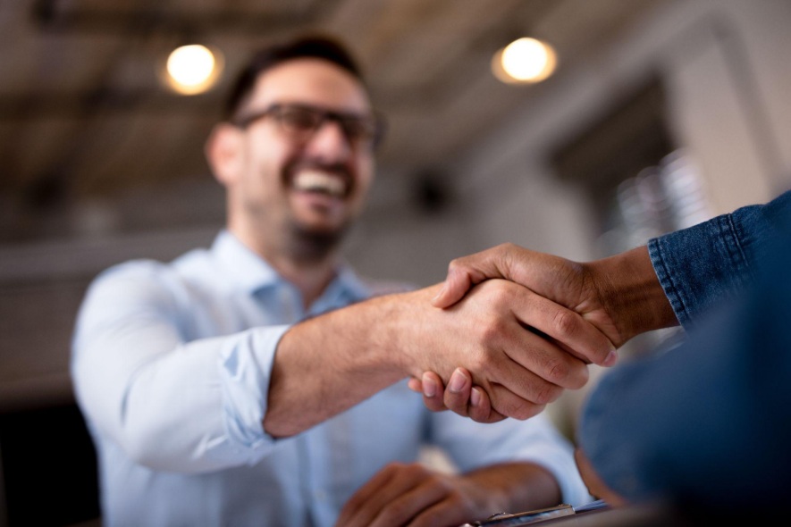 shaking hands during a one on one consultation