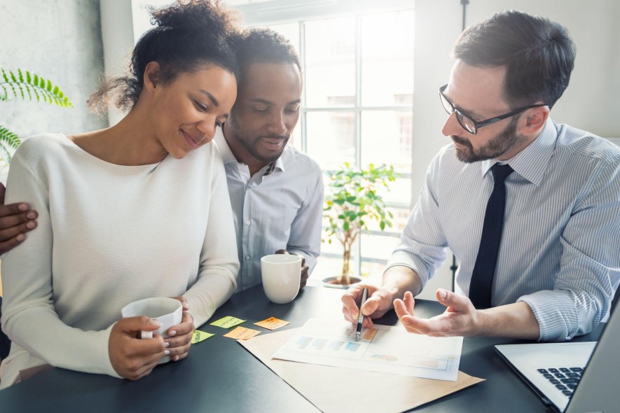 Couple discusses cost containment plans with financial advisor