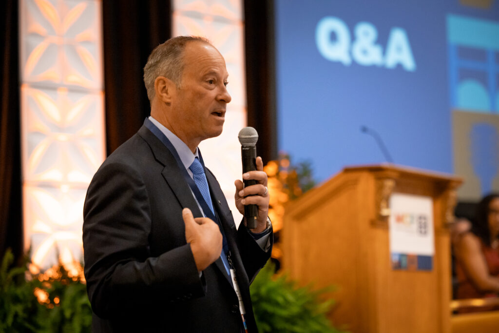 Roundstone Insurance's President and Founder, Mike Schroeder, presenting at MCF 2025