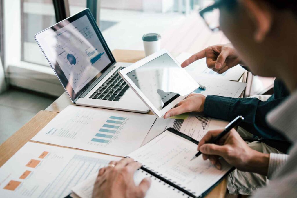 HR team planning an employee benefits program around a conference table