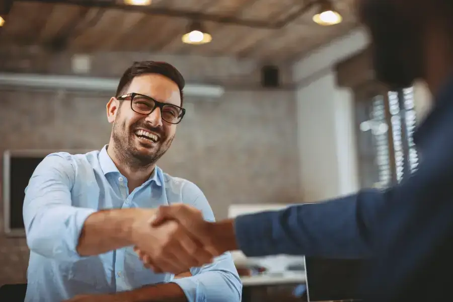 shaking hands during a one on one consultation