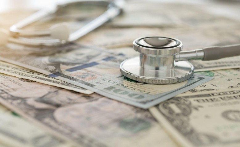 stethoscope on paper money