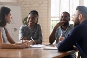 Team Discusses Employee Benefits Engagement Strategies in Meeting